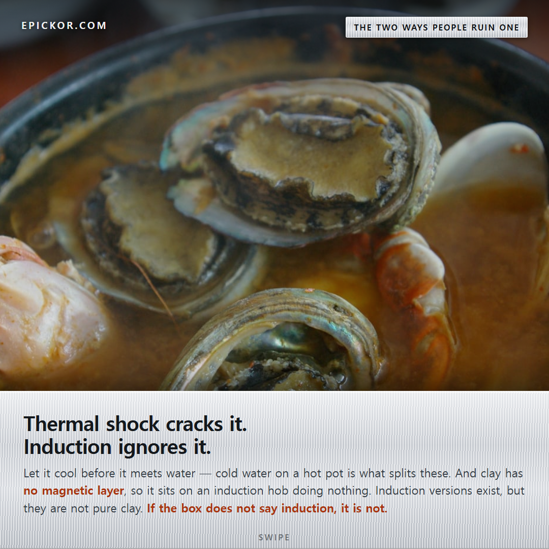 Obunjagi ttukbaegi — Jeju abalone stew with shrimp and clams in a black earthenware pot