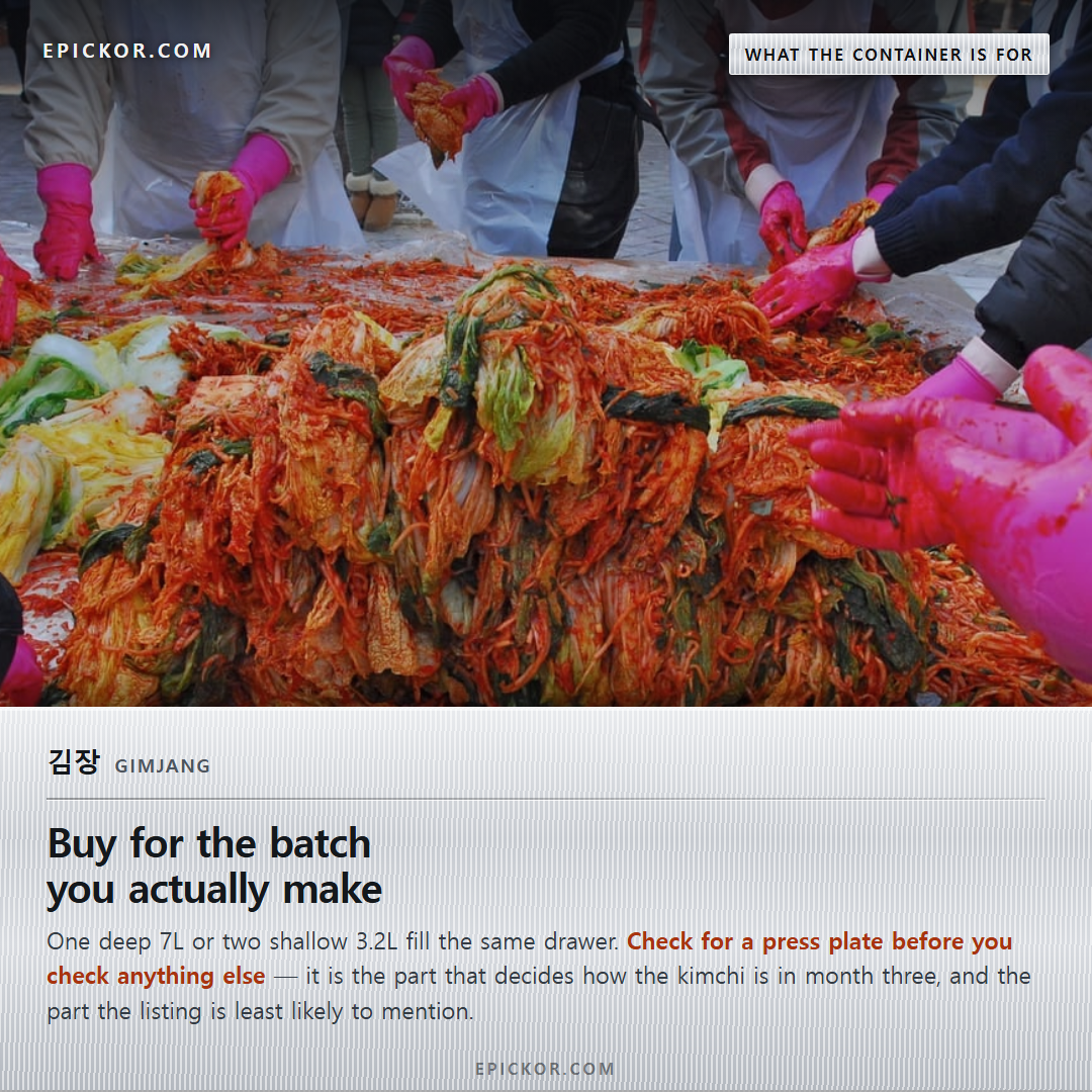 김장 (gimjang) — a long outdoor table of people making kimchi together, trays of salted cabbage and red seasoning in front of them