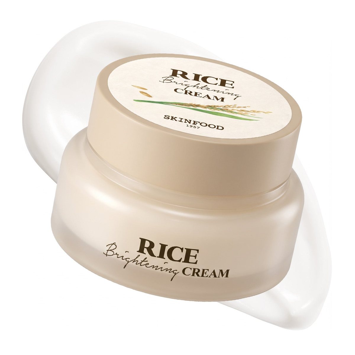 A jar of Skinfood Rice Brightening Cream with a beige lid showing rice stalks, set against a swoosh of white cream.