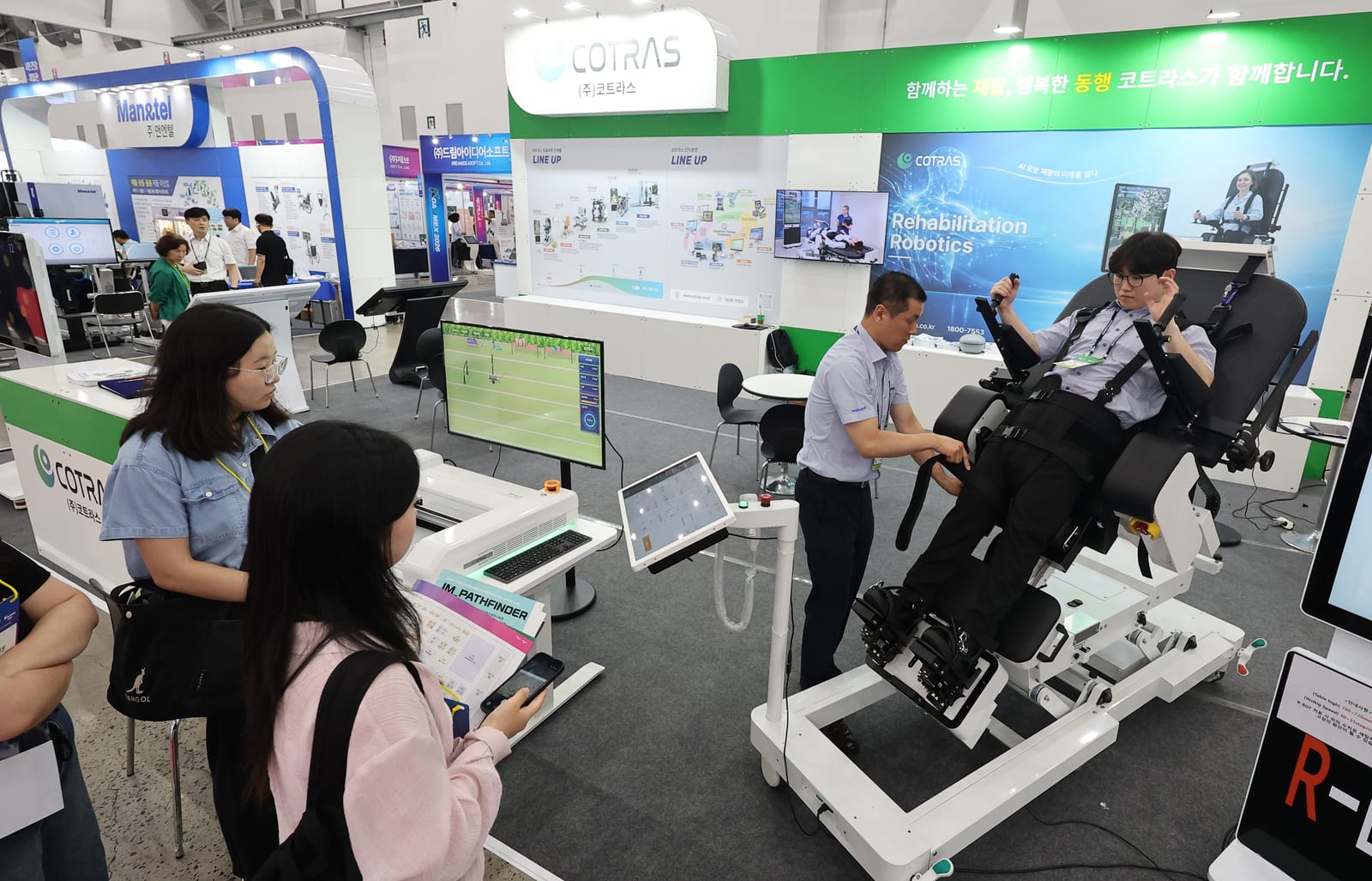 Visitors examine Korean rehabilitation technology at Medi Expo Korea 2026 in Daegu.