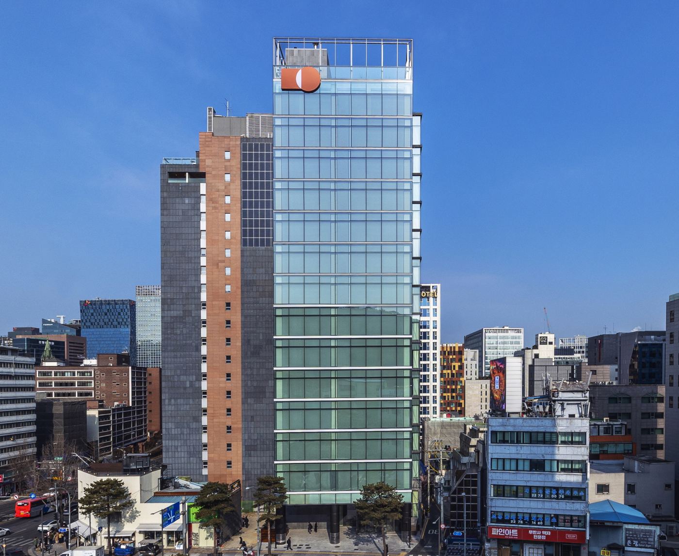 Samyang Foods' new head office in Myeongdong, Seoul: a glass tower with the orange Samyang logo at the top, shown in the company's January 2026 press release.
