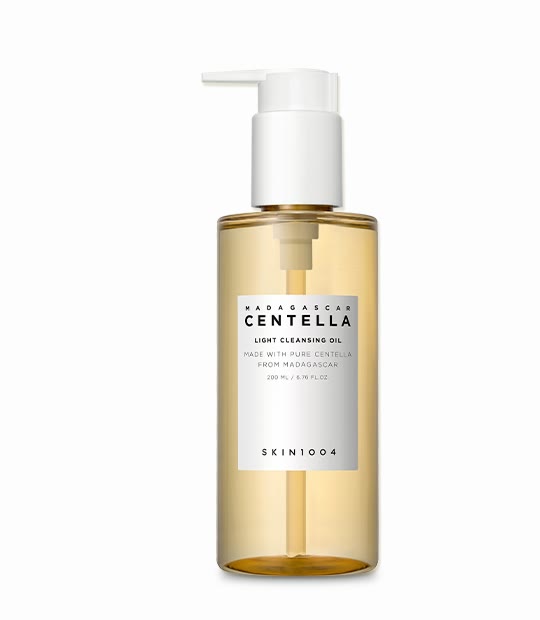 A SKIN1004 Madagascar Centella Light Cleansing Oil bottle with a white pump and a pale golden oil, labelled 200 mL / 6.76 fl. oz.