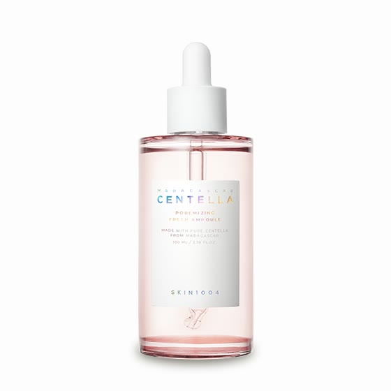 A pink-tinted SKIN1004 Madagascar Centella Poremizing Fresh Ampoule bottle with a white dropper and a white label with iridescent "Centella" lettering, labelled 100 mL / 3.38 fl. oz.