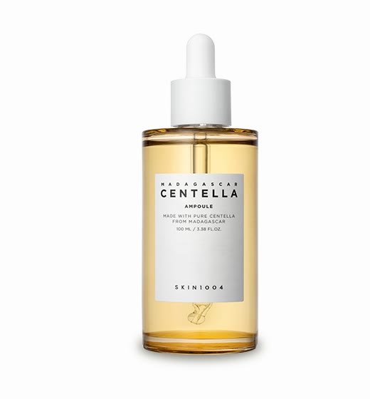 A SKIN1004 Madagascar Centella Ampoule bottle with a white dropper and amber liquid, its white label reading "Madagascar Centella Ampoule, made with pure centella from Madagascar, 100 mL / 3.38 fl. oz." and "SKIN1004", on a white background.