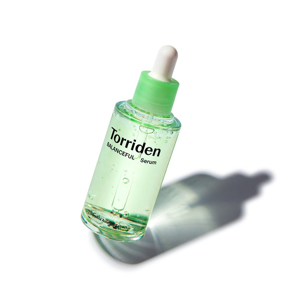 A green-tinted Torriden Balanceful serum bottle with a dropper cap, photographed on a white background.
