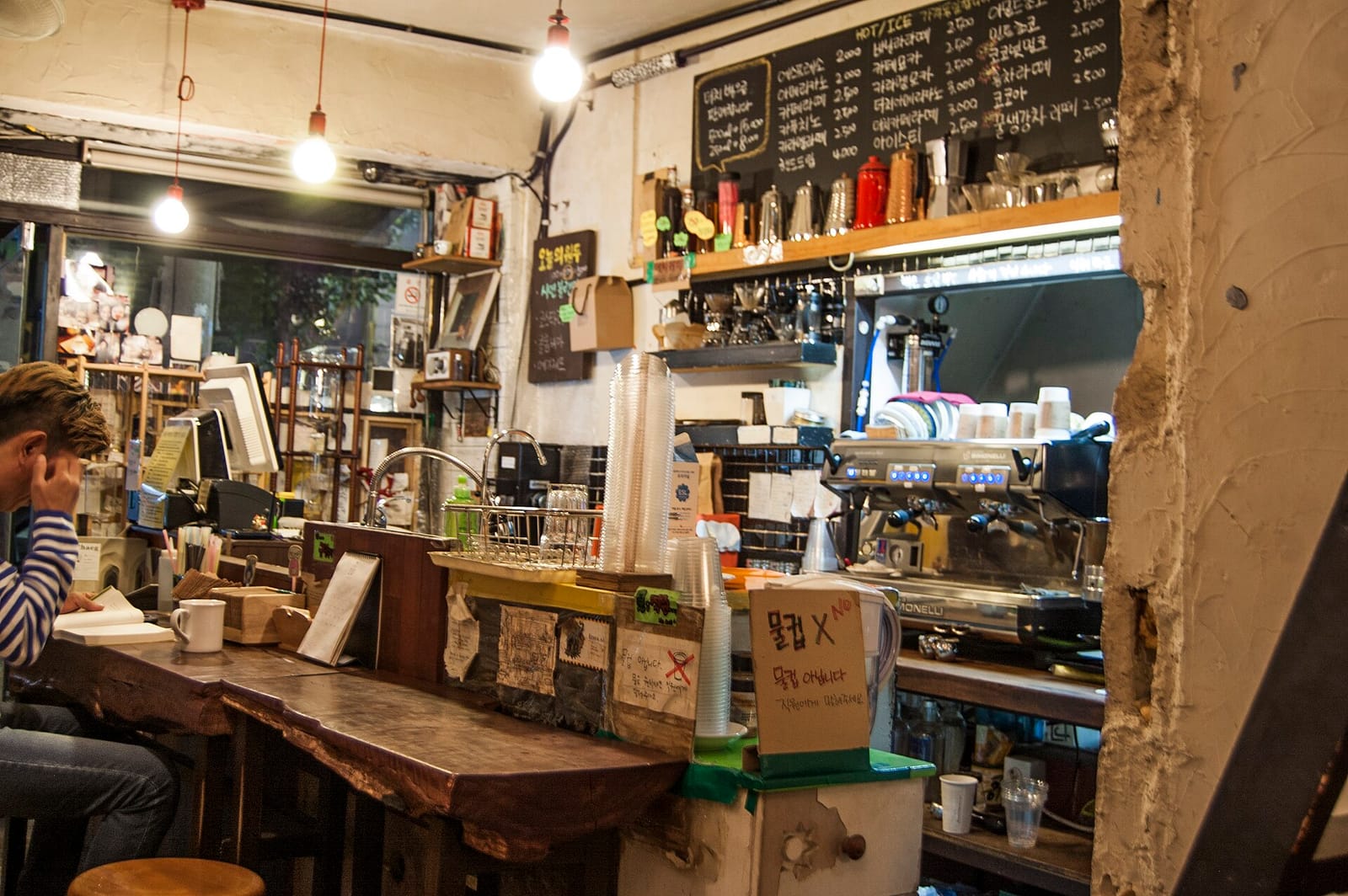 Cafe tables and warm lighting in a Seoul coffee shop
