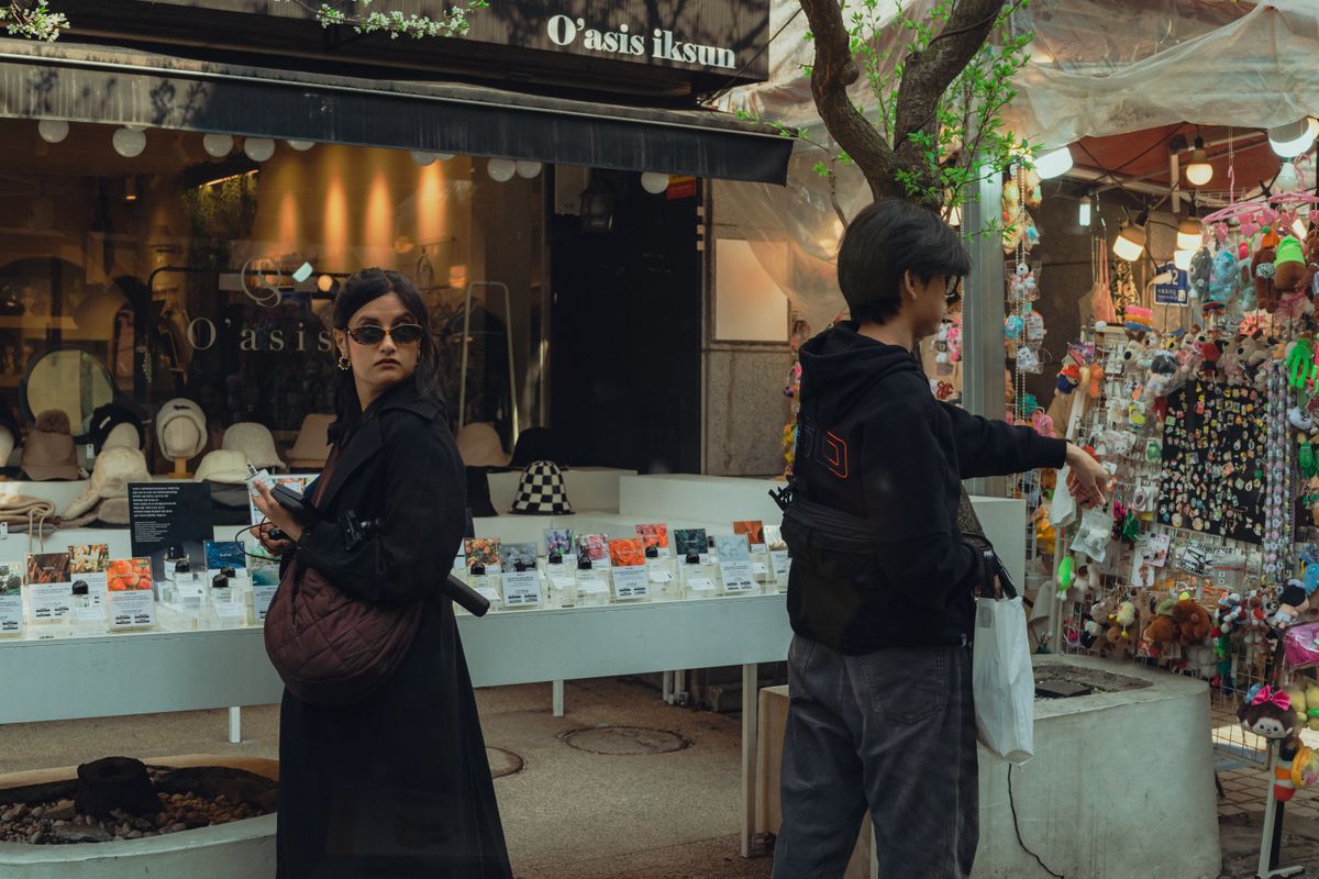 People shopping along a lively Ikseon-dong street in Seoul.