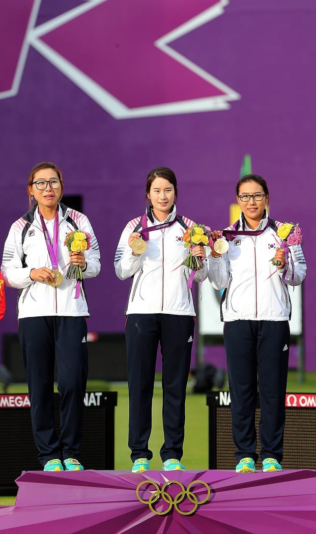 South Korea's women's archery team with their London 2012 Olympic gold medals.