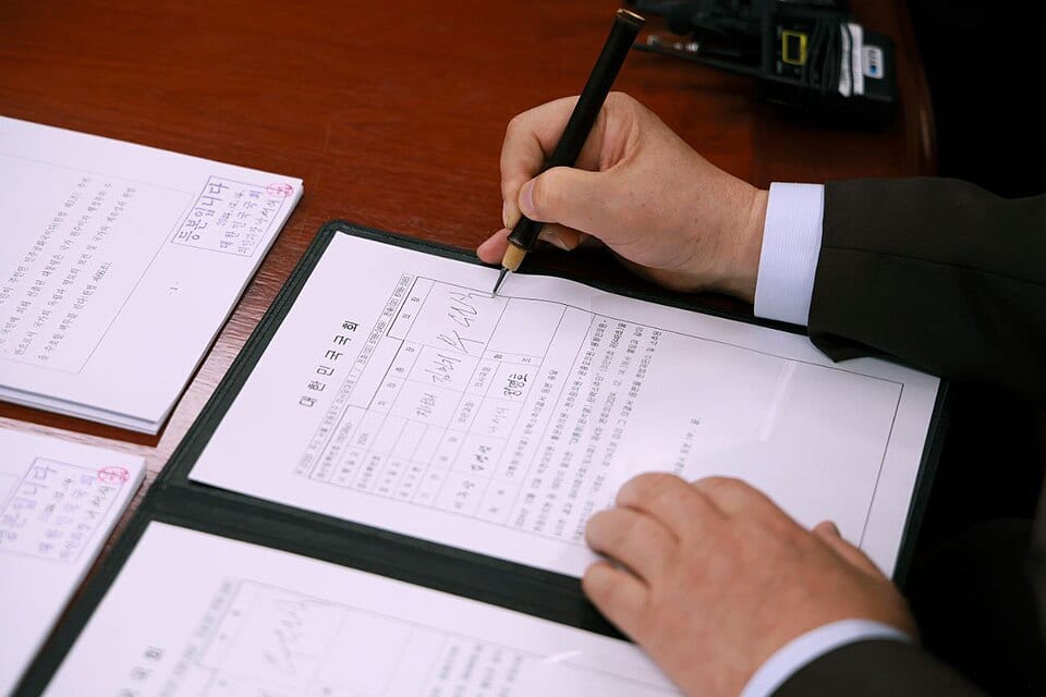 National Assembly Speaker Woo Won-shik signing the impeachment resolution on December 14, 2024.