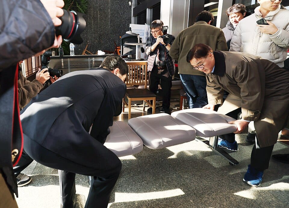 National Assembly officials inspect damage inside the Assembly on December 4, 2024.
