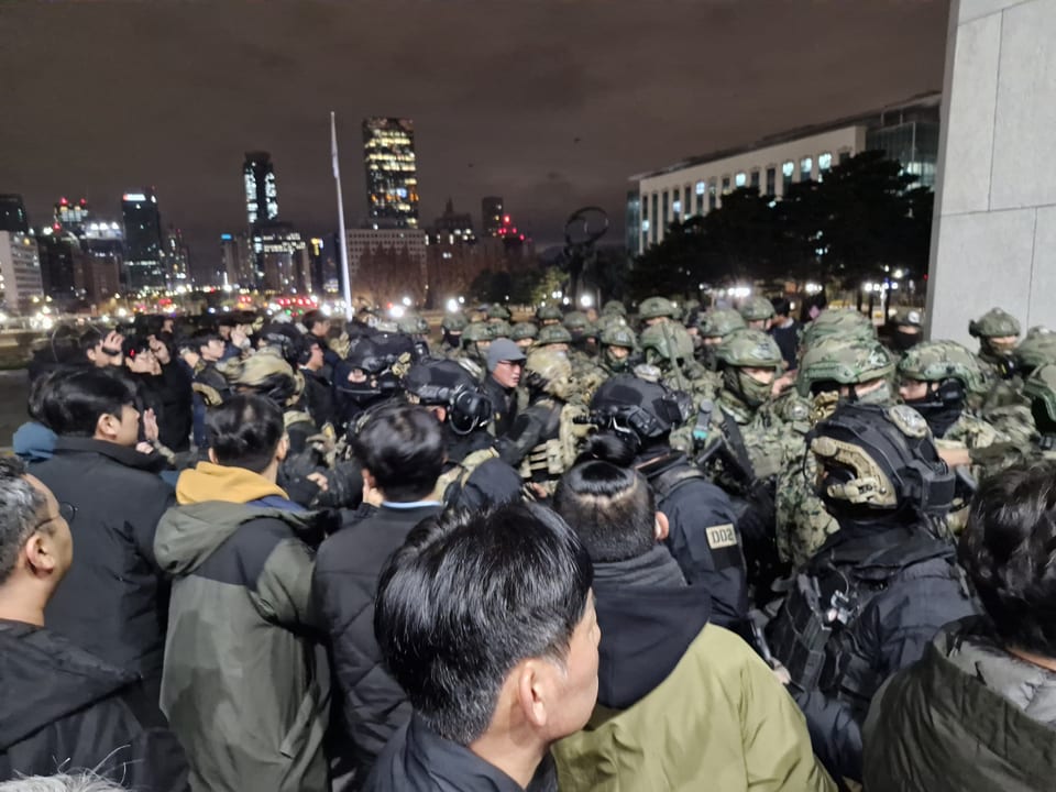 South Korean soldiers and civilians outside the National Assembly during the martial law crisis.