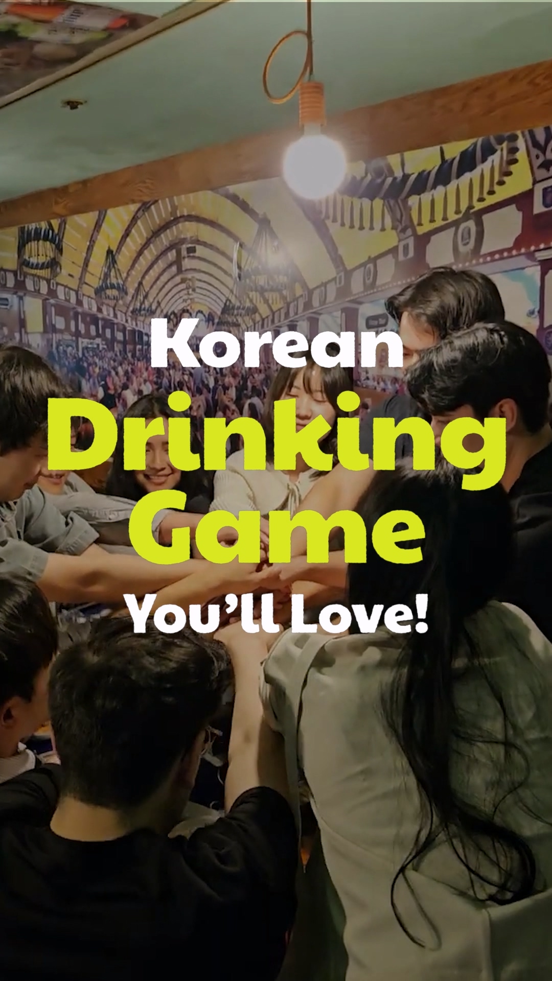 A lively group of friends playing a game at a Korean pub