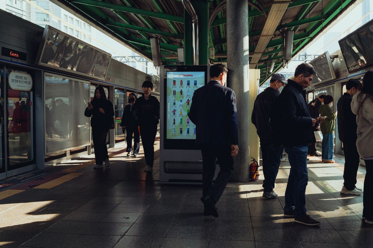 Commuters waiting on a Seoul subway platform at Guro station.
