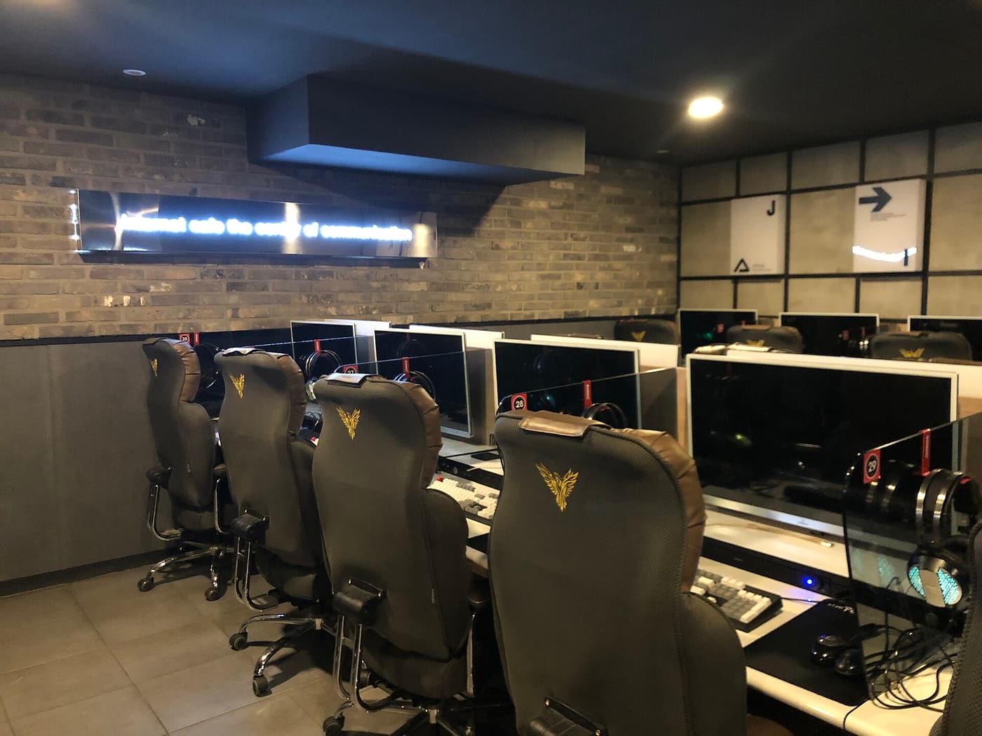 Rows of gaming seats and monitors inside a Korean PC bang.