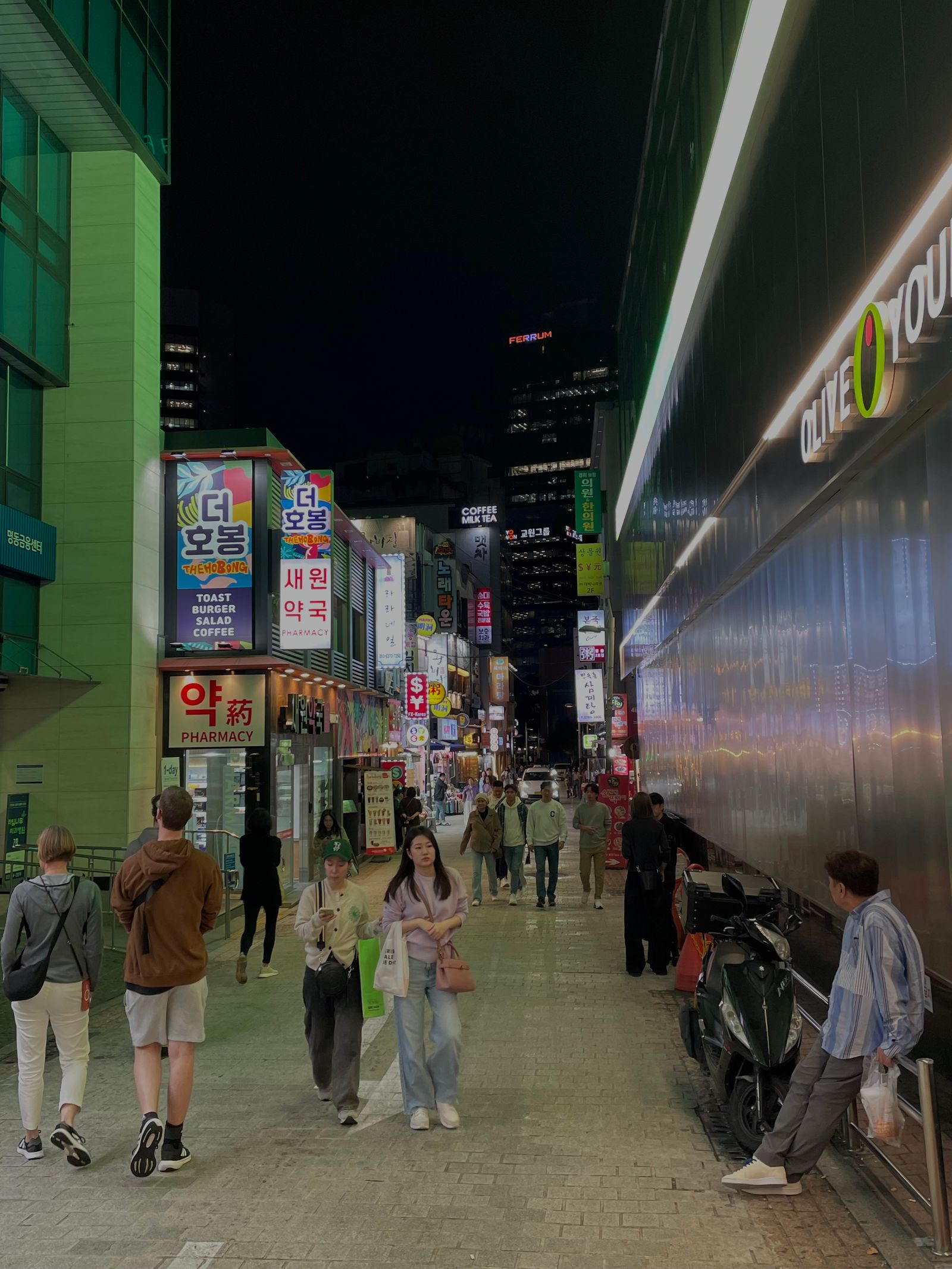 Myeongdong's illuminated shopping streets at night.