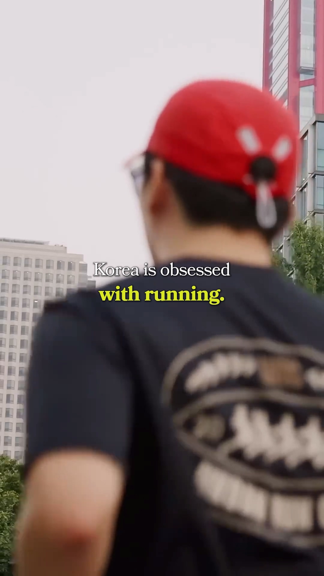 A close up of a runner's high-tech smartwatch and shoes