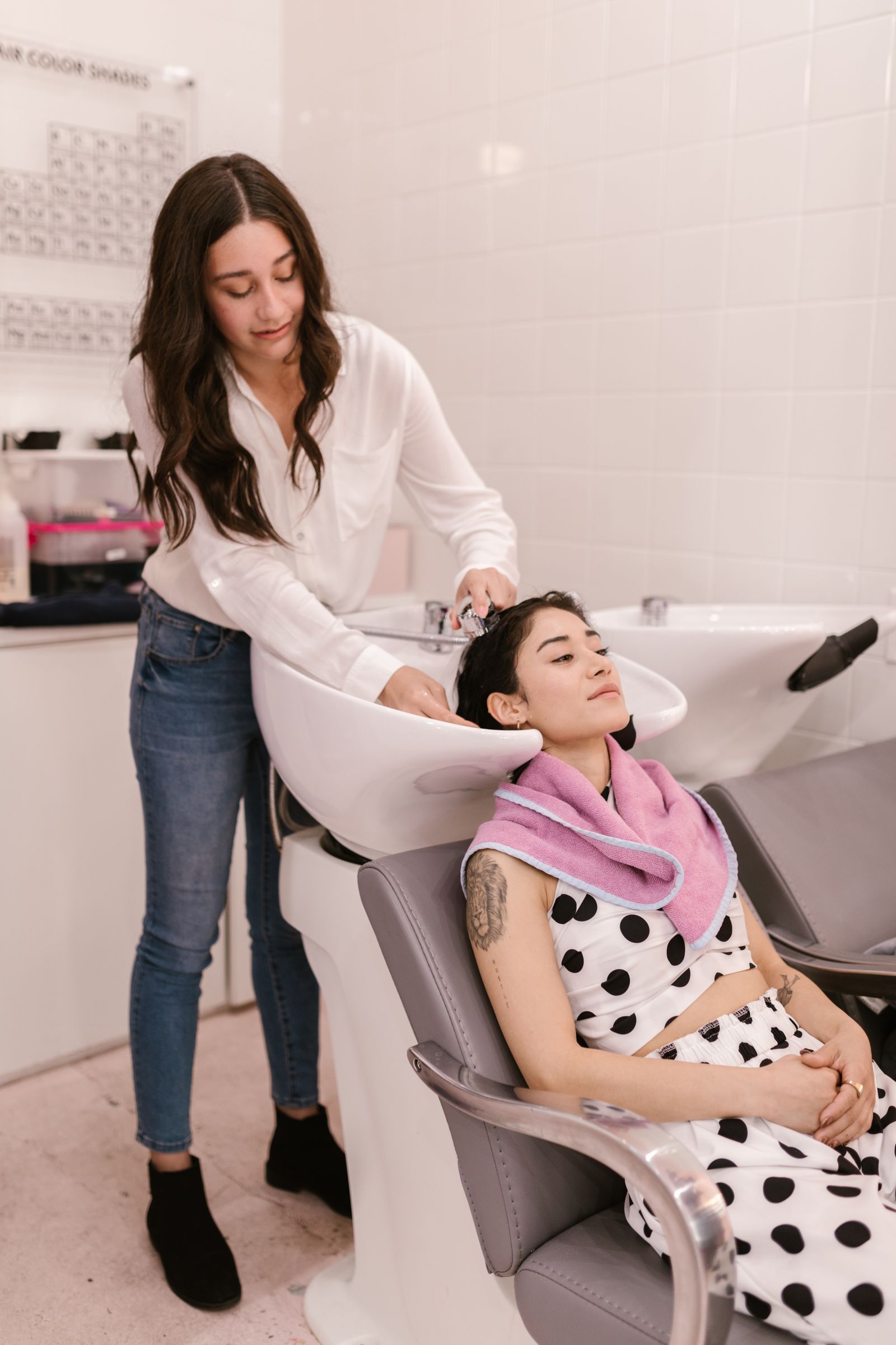 A client at a salon shampoo station.