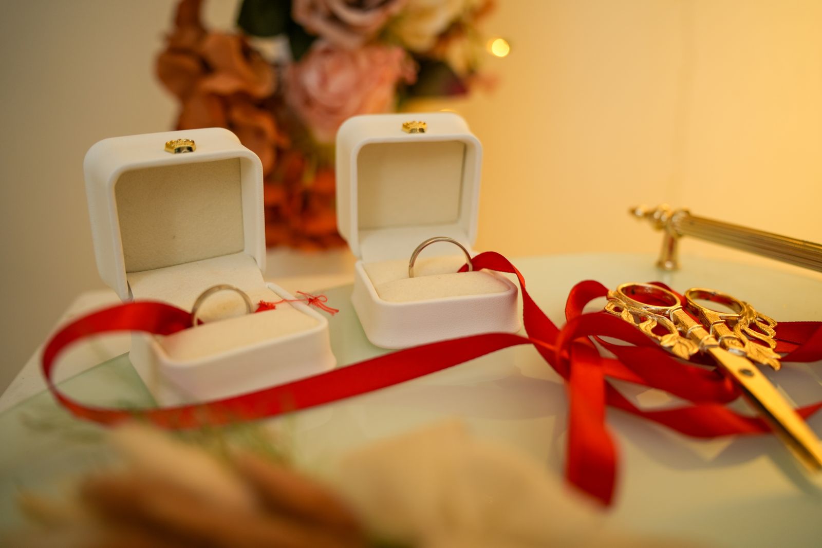 Two anniversary rings beside a small gift