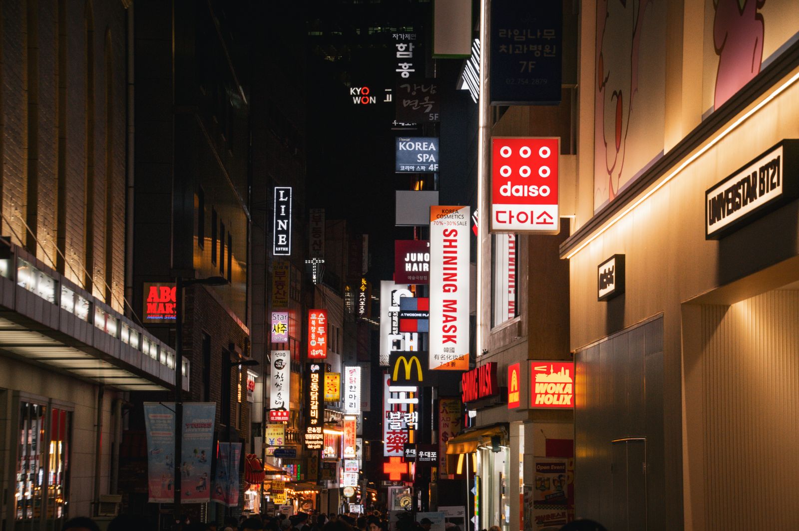 A Daiso sign among Seoul’s nighttime shopping streets