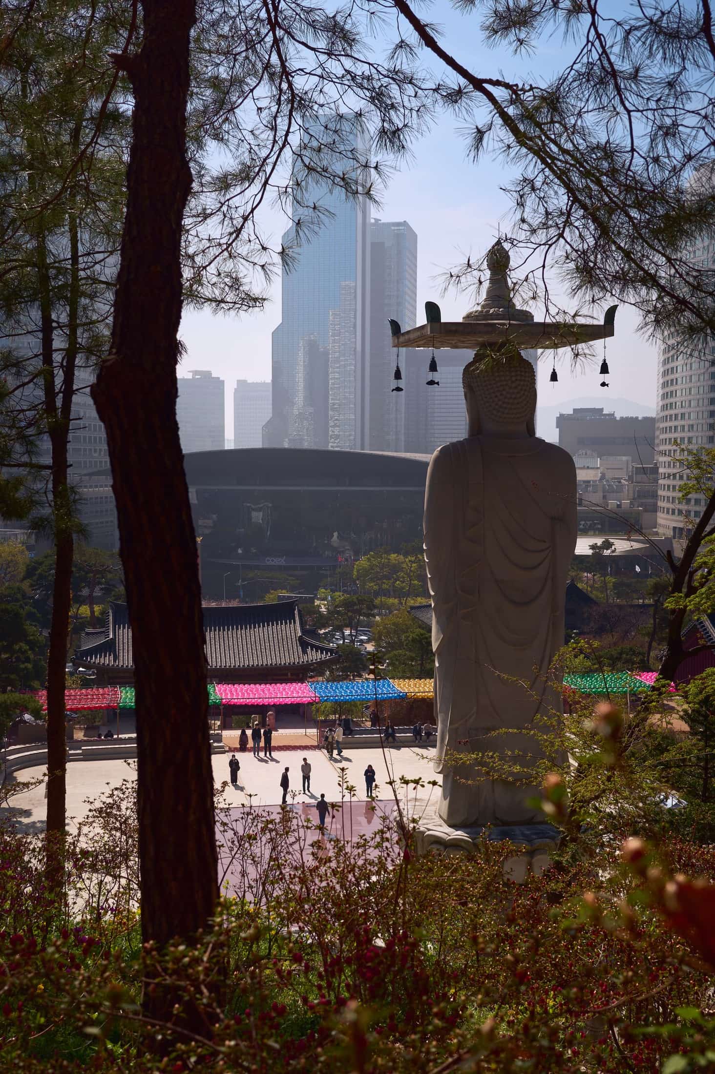The Bongeunsa Buddha with COEX and Gangnam towers beyond.