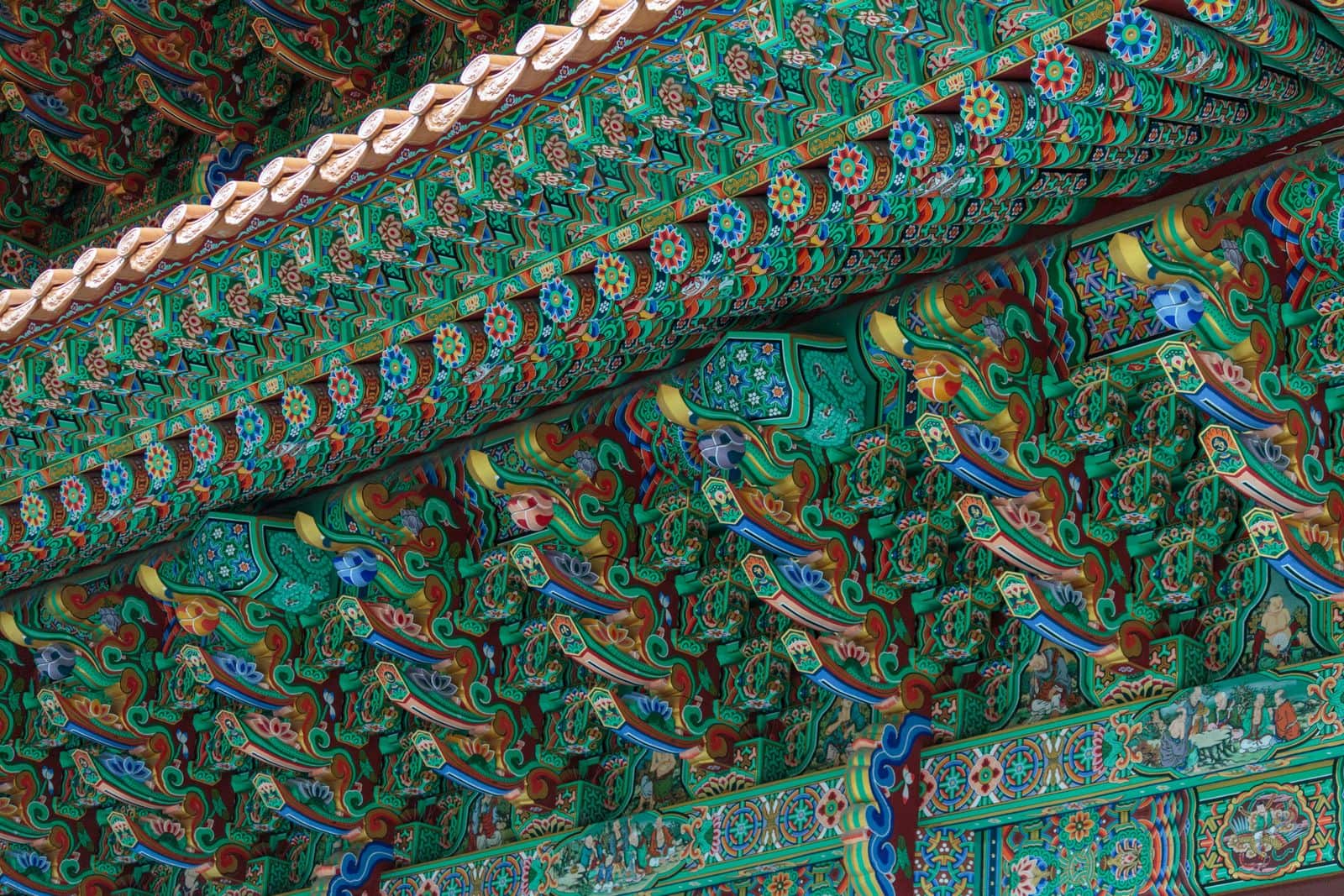 Dancheong-painted brackets beneath a Korean temple roof.