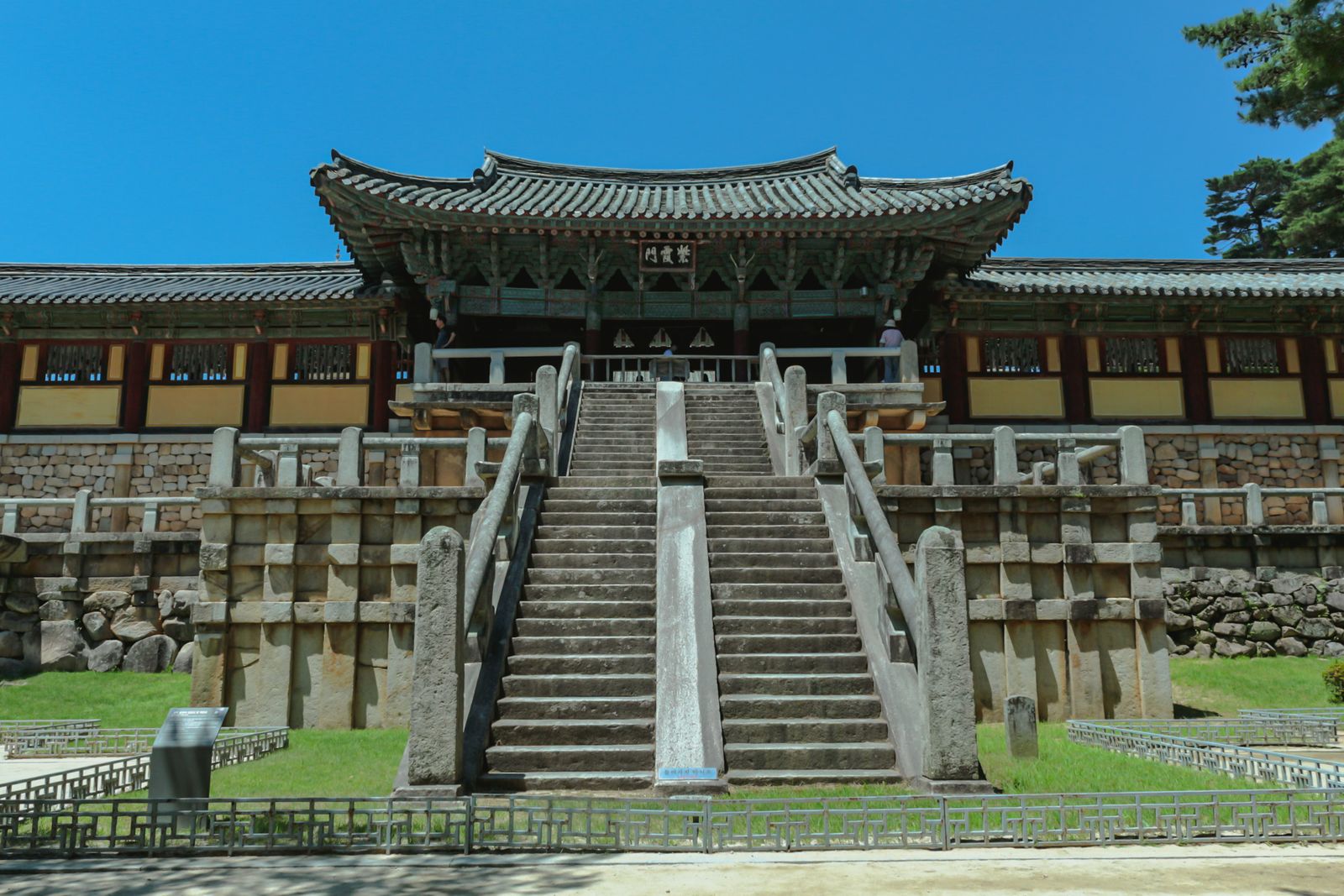 The stone stairway facade of Bulguksa Temple in Gyeongju under a clear blue sky.