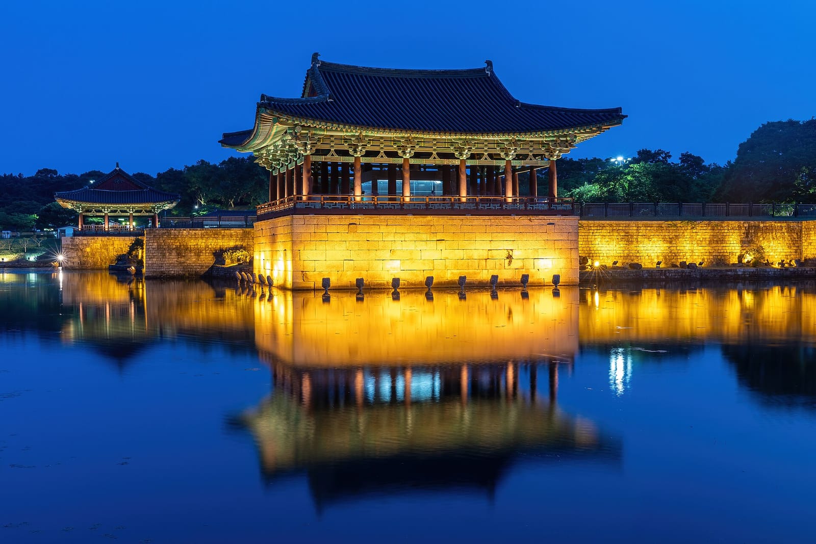 Donggung Palace pavilions reflected in Wolji Pond at blue hour in Gyeongju.