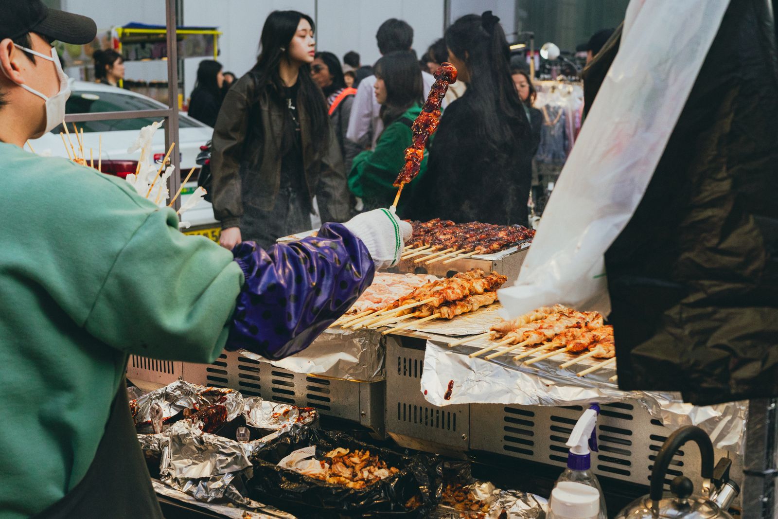 A Seoul street-food stall serving customers at night
