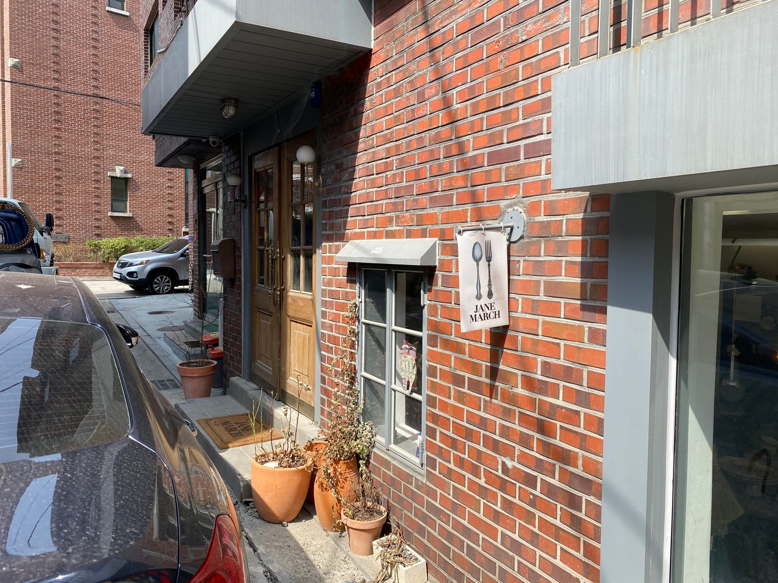 A brick storefront in Seongsu-dong showing the warehouse-to-retail mood of the area.