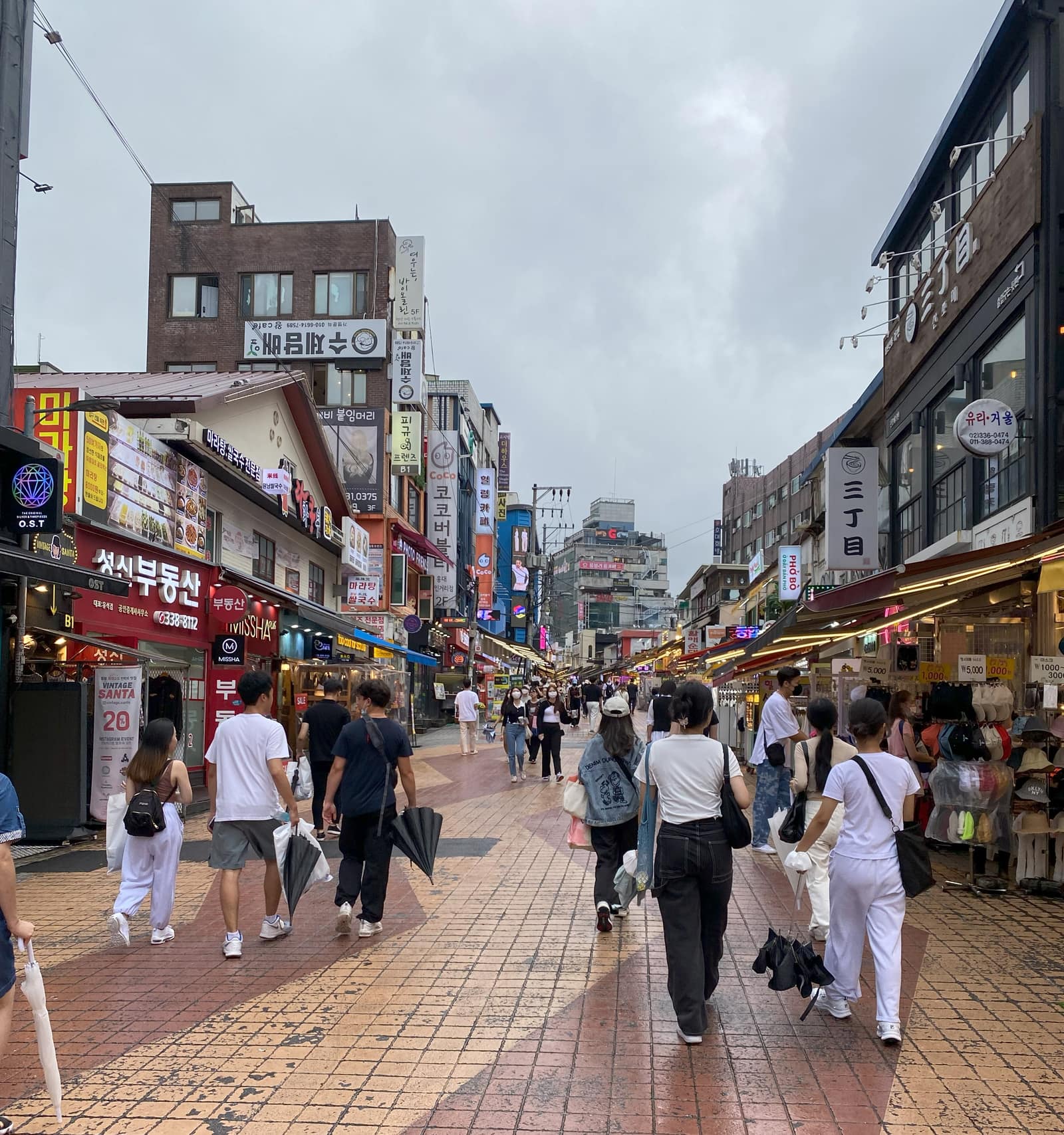 Hongdae shopping street with the kind of youth-culture retail context Korean streetwear visitors compare.