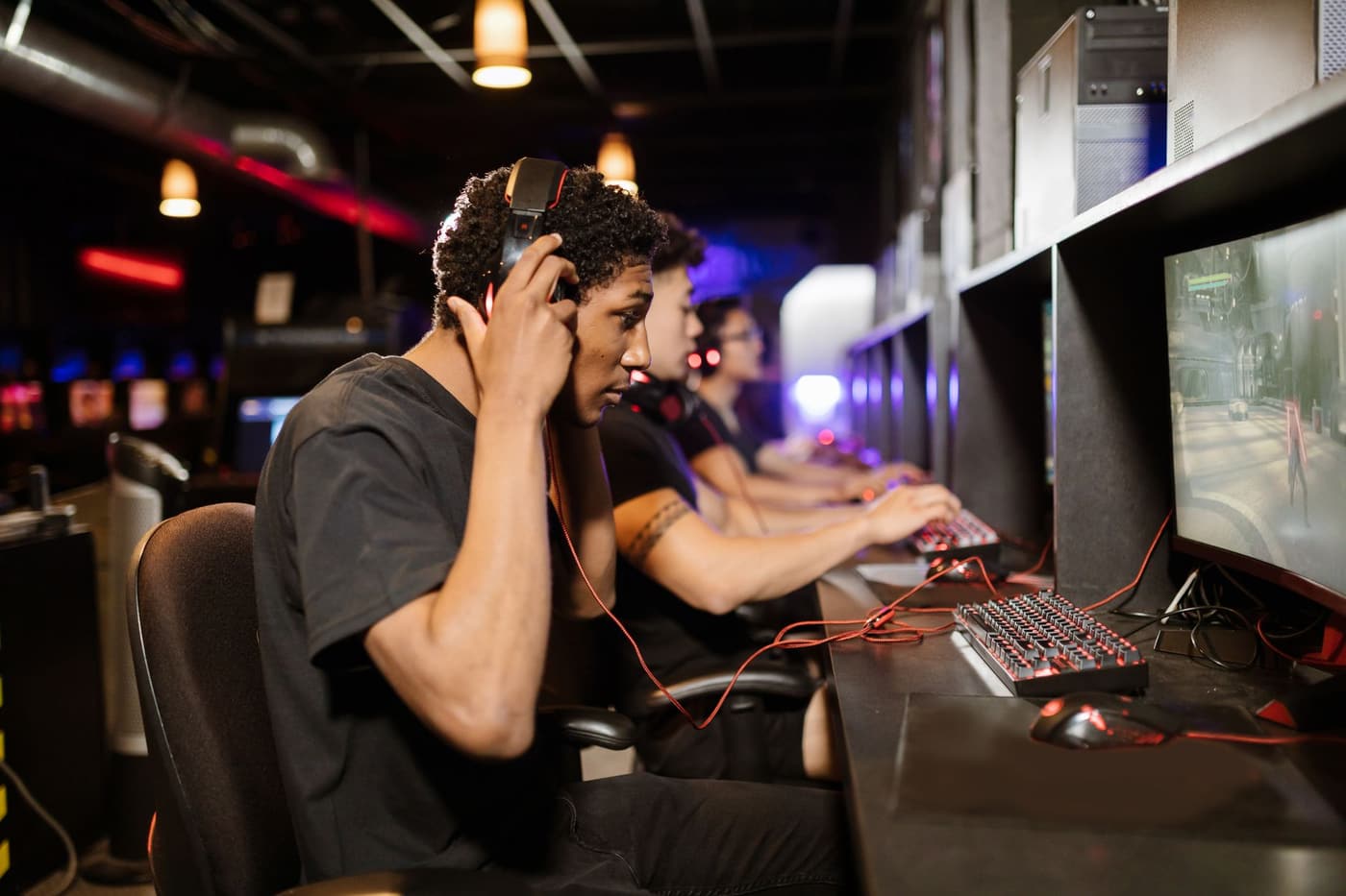 A group of gamers focused in a modern gaming lounge