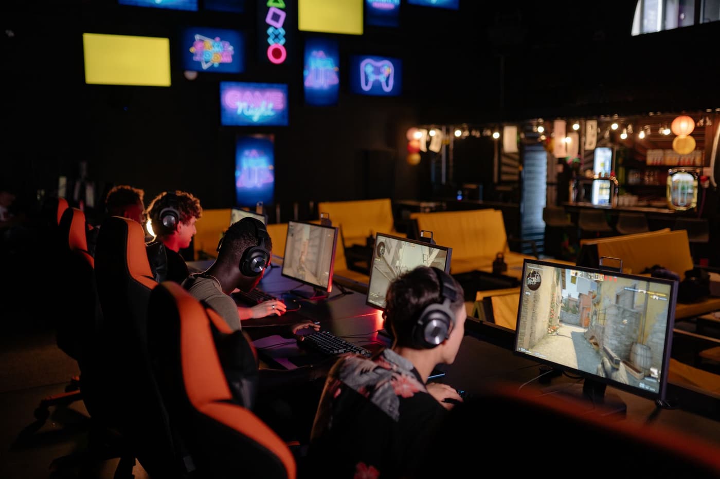Players gaming together in an internet cafe setting