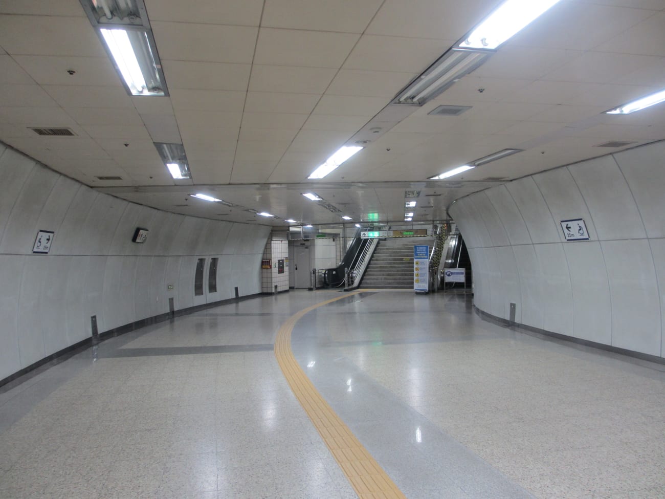 An escalator leading out of a Seoul subway station.