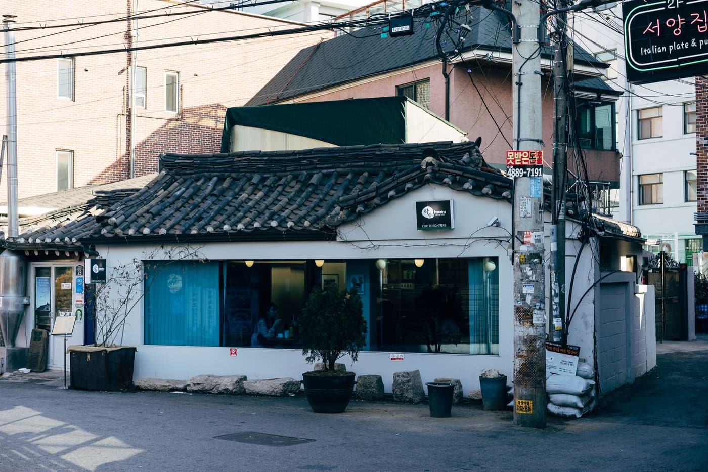 A traditional-looking cafe facade on a Seoul street.