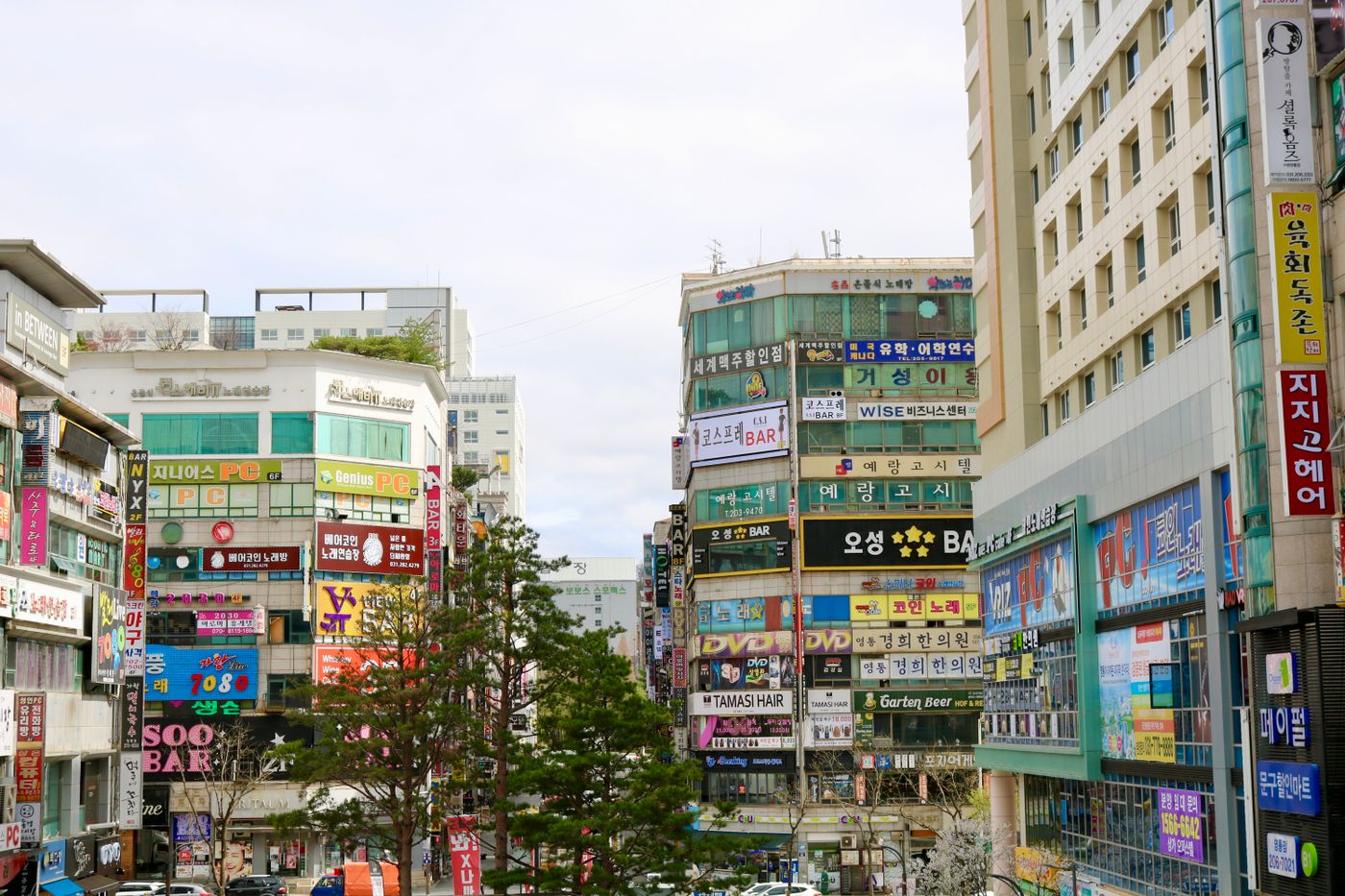 Seoul's advertising-heavy streets show why pop-ups fit naturally into a city where brands compete visually in public space.