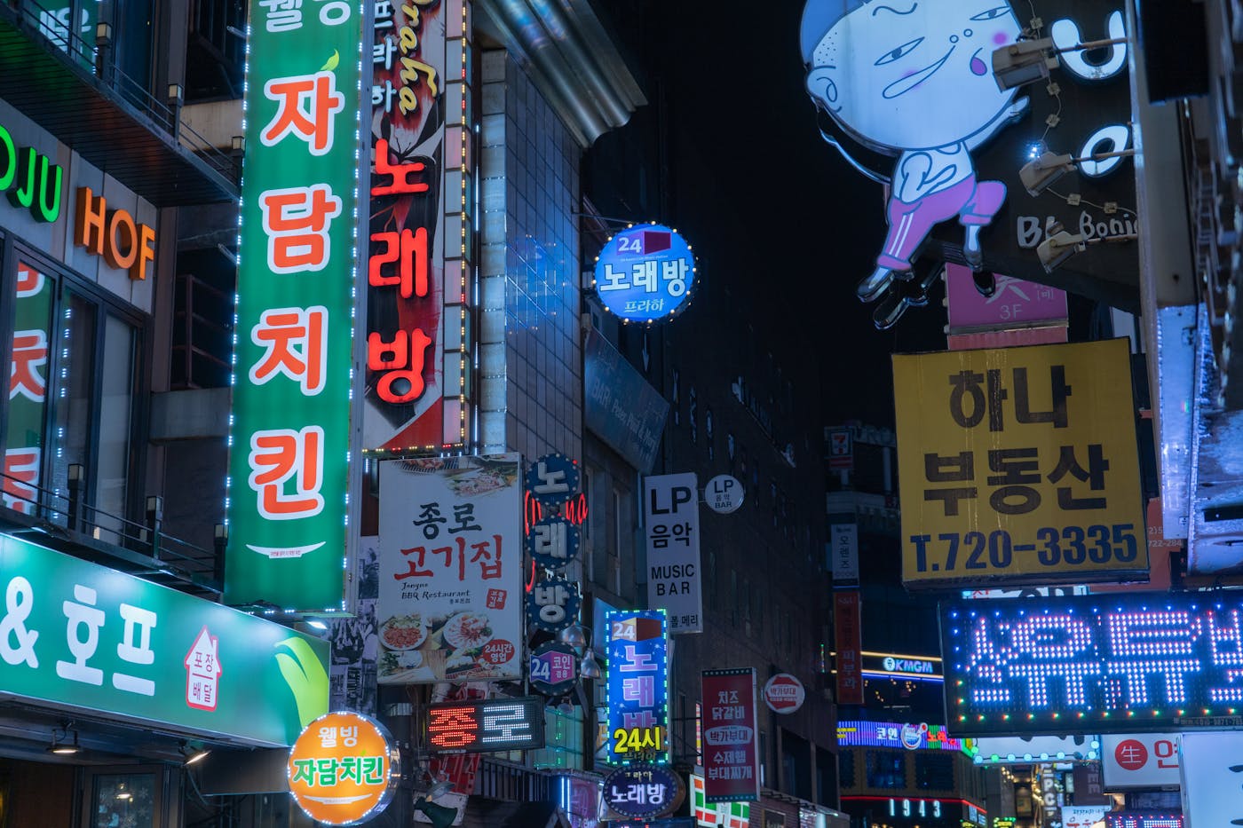 Seoul at night, where shopping, cafes, signs, and crowds make temporary brand events feel like part of the city's social rhythm.