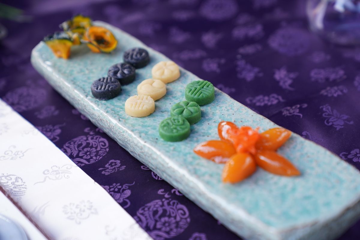 Traditional Korean sweets on a ceramic plate, fitting the food-and-gift side of Korean holidays.