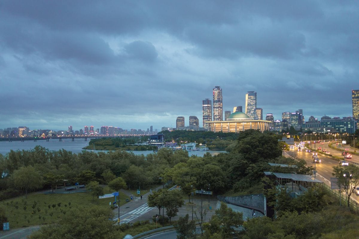 The Han River and Seoul skyline at dusk after a humid summer day