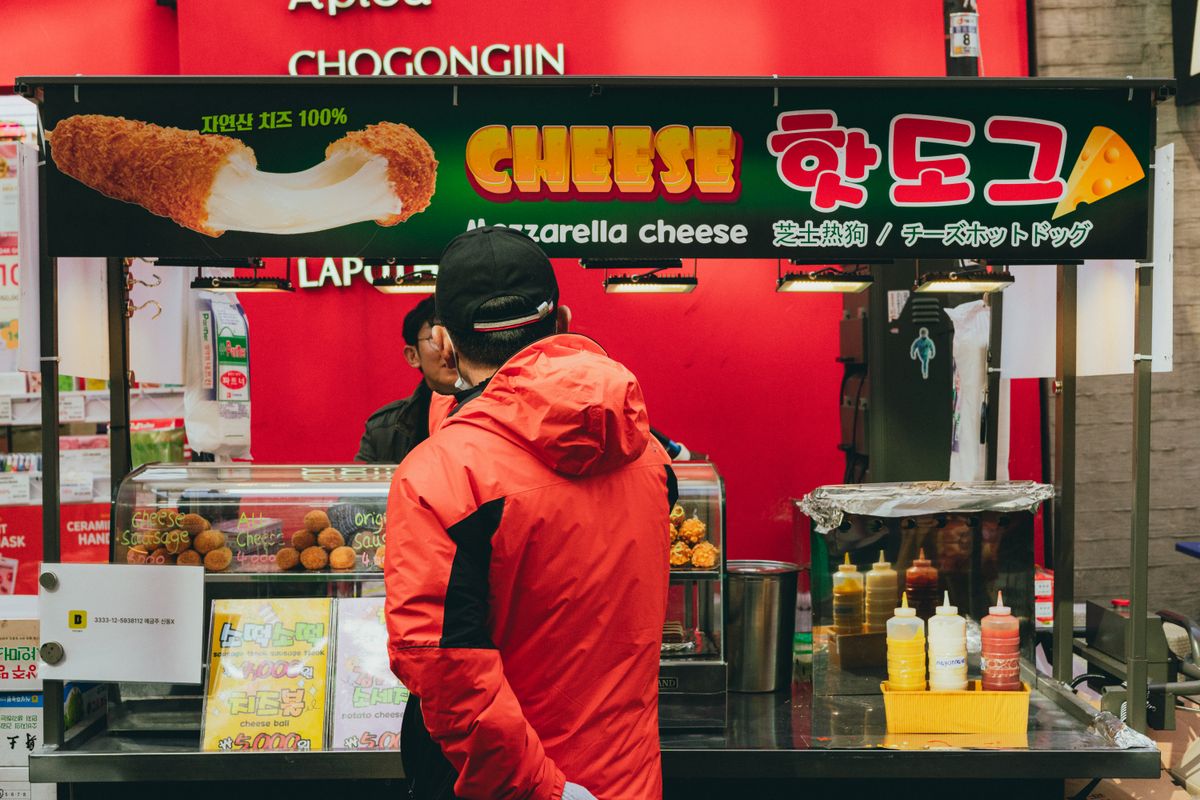 A Seoul street-food stall selling Korean hot dogs, useful for understanding what to eat in Korea and what to pack later.