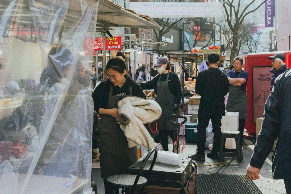 A Myeongdong street scene in Seoul where beauty shopping, salons, and travel foot traffic overlap.