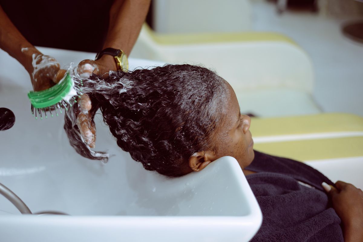 A shampoo foam salon scene that shows the sensory side of head spa and scalp-care services.