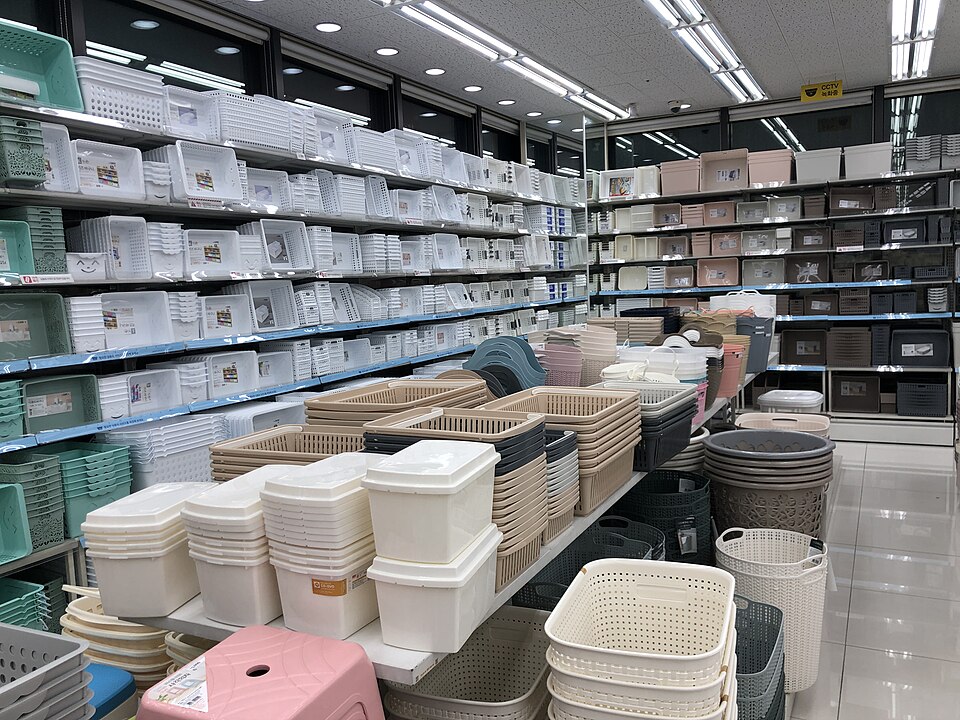 Storage baskets and small plastic organizers stacked inside Daiso Wonju Musil, showing the practical low-cost organization aisle tourists should prioritize.