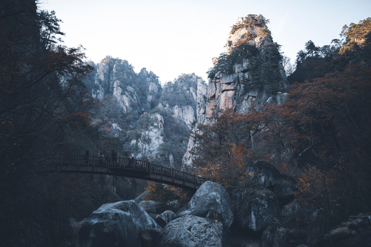 A bridge and rocky valley in Seoraksan National Park during autumn.