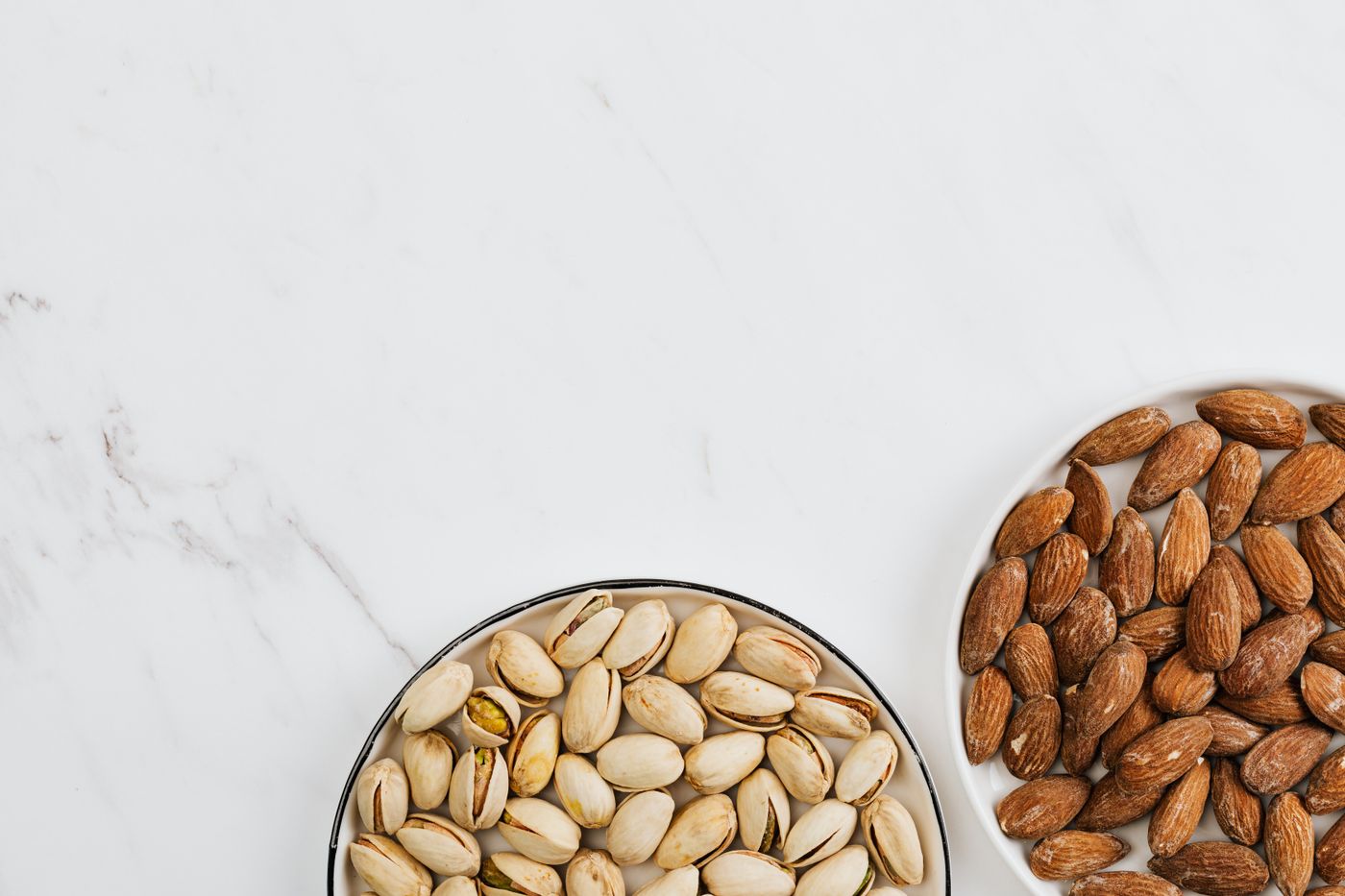 A flatlay of nuts and light snacks, useful for comparing Korean wellness snacks with normal global healthy-snack logic.