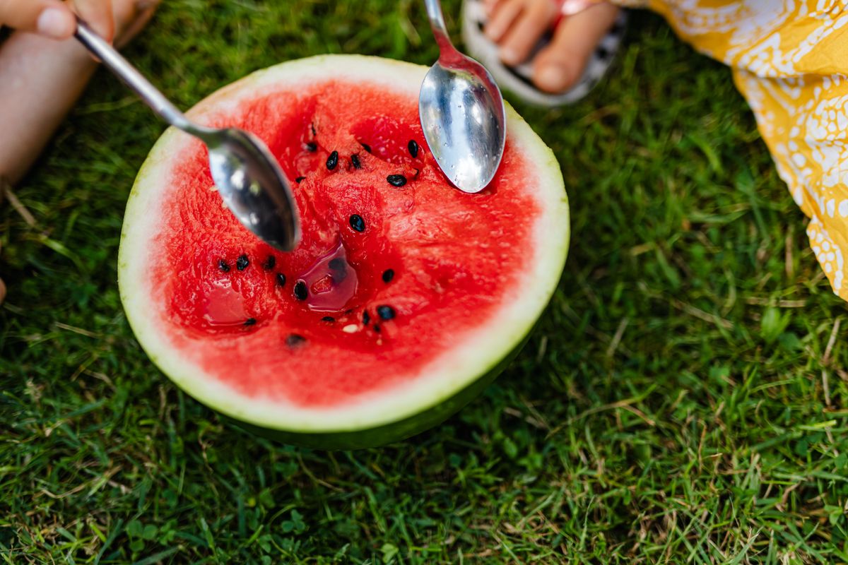 Sliced watermelon outdoors, the kind of simple summer ingredient that turns into group dessert in Korea.