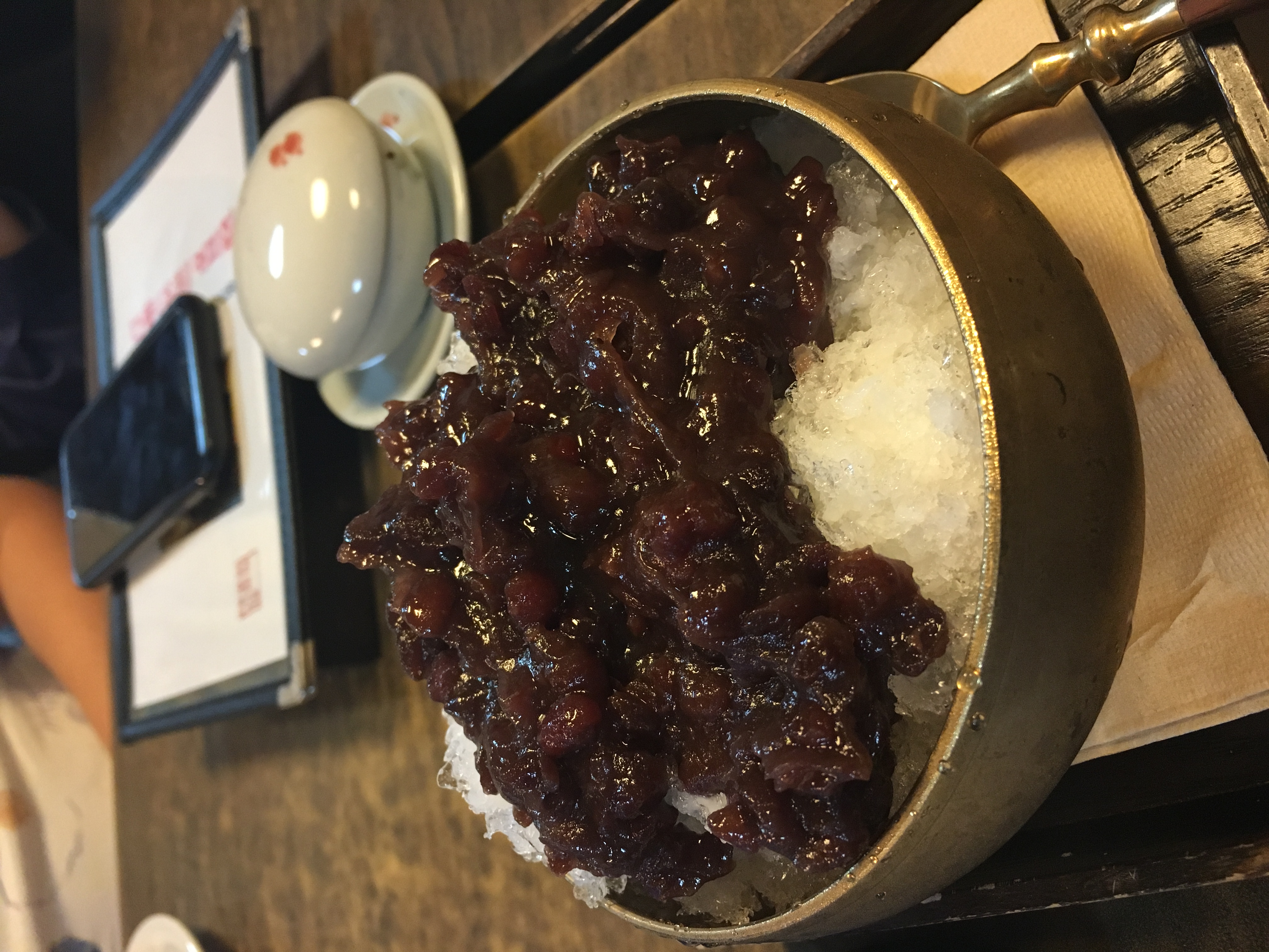 A classic red bean patbingsu bowl with shaved ice and sweet red beans.