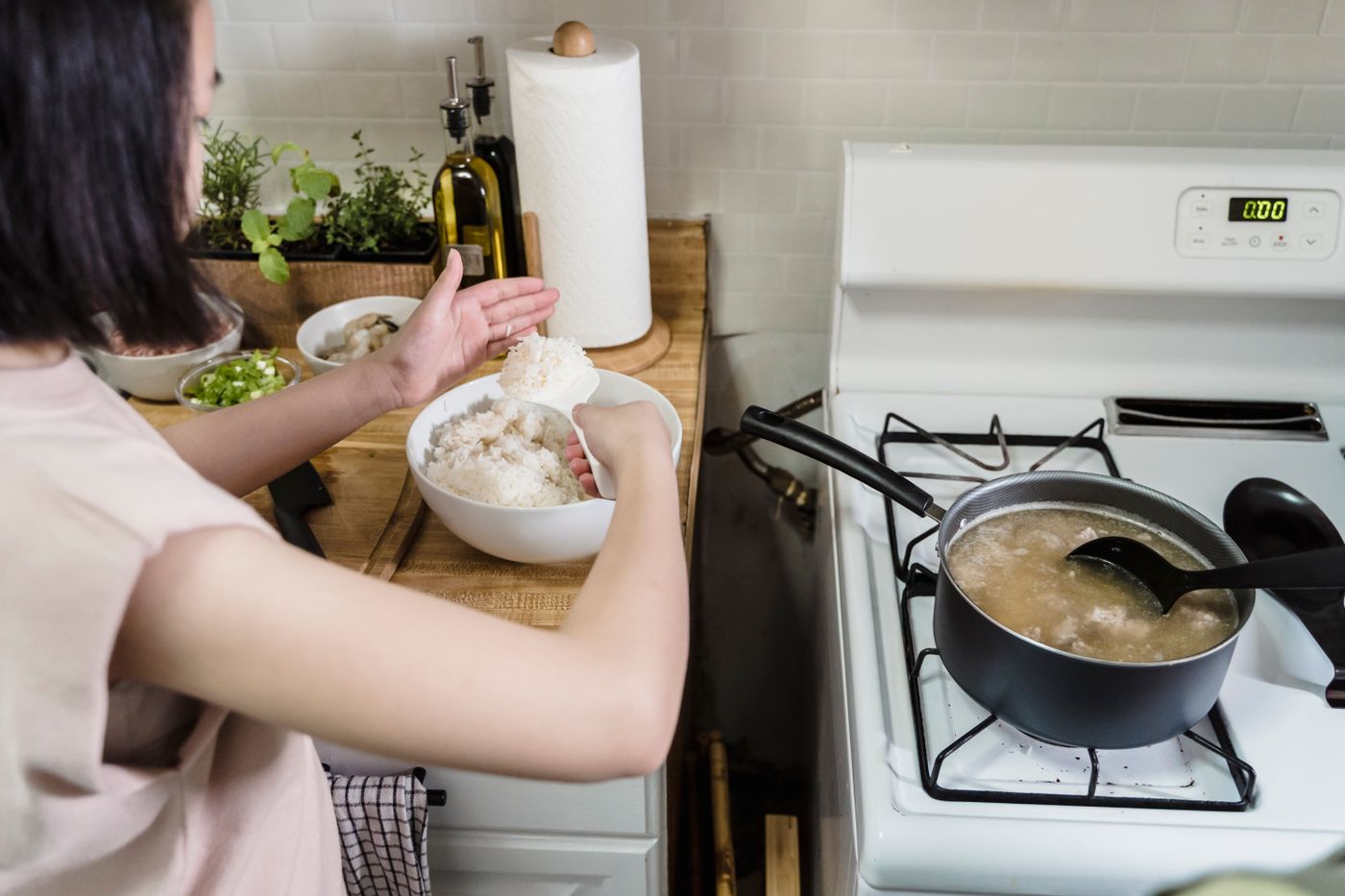 A home kitchen rice preparation scene.