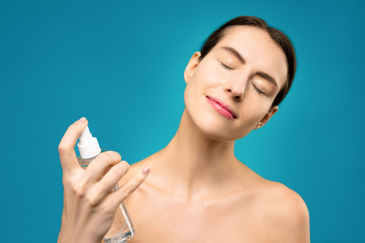 A facial mist being applied during a skincare routine.