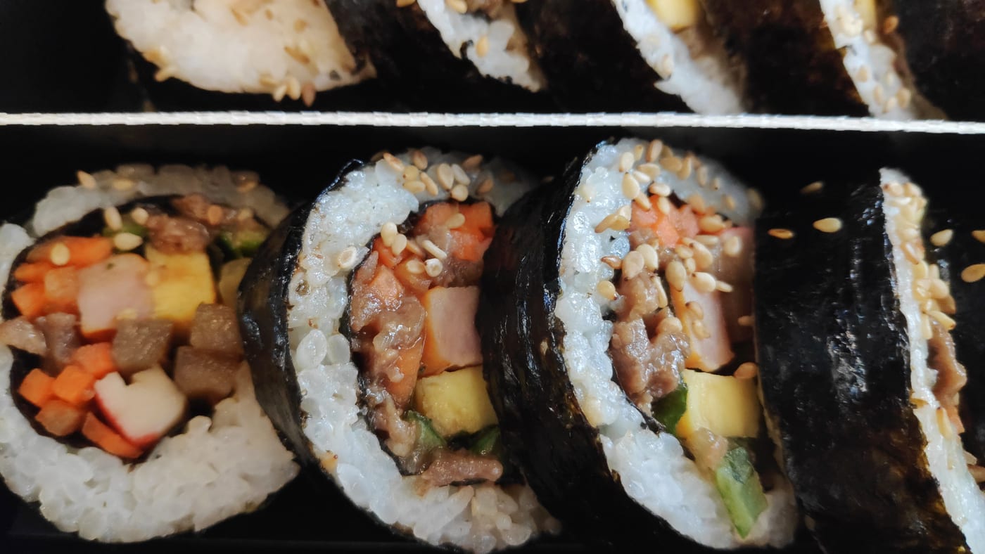 A Korean KTX gimbap dosirak with seaweed rolls arranged for travel.