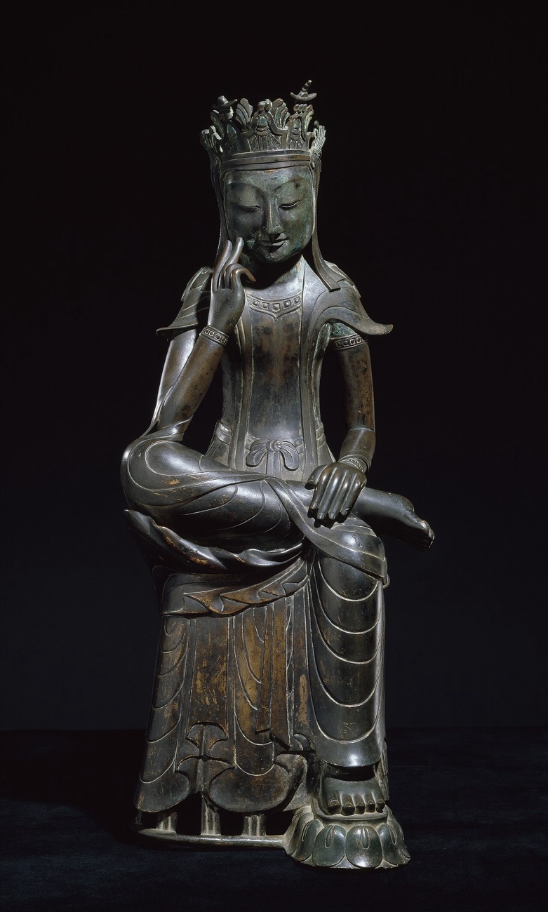 The gilt-bronze Pensive Bodhisattva, National Treasure No. 78, against a black background.